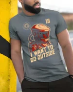 Intriguing I Want To Go Outside Astronaut Graphic Tee - model wearing grey tee, leaning on column