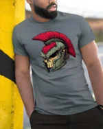 Spartan Skull Roman Helmet Warrior Graphic Tee - model wearing grey tee, leaning on column