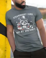 Entertaining Strawberry Jams But My Gun Dont Western Tshirt - model wearing grey tee, leaning on column