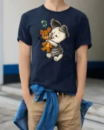 Adorable Hugging Piglet Teddy Bear Friend Graphic Tee - model wearing navy tee with hands in pockets