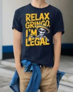 Relax Gringo I’m Legal Sombrero Skeleton Graphic Tee - model wearing navy tee with hands in pockets