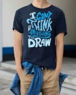 I Can’t Think Of Anything To Draw Graphic Tee - model wearing navy tee with hands in pockets