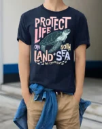 Protect Life On Both Land Sea Turtle Graphic Tee - model wearing navy tee with hands in pockets