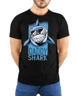 Catchy Daddy Shark Sunglasses Ocean Predator Graphic Tee - model wearing black tee with hands behind back