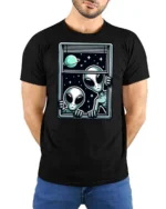 Intriguing Extraterrestrial Window Peeking Space Graphic Tee - model wearing black tee with hands behind back