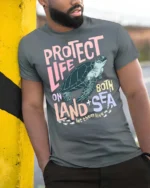 Protect Life On Both Land Sea Turtle Graphic Tee - model wearing grey tee, leaning on column