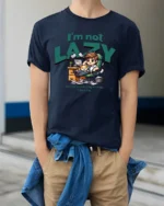 Funny Lazy Employee Sleeping Kitten Workspace Graphic Tee - model wearing navy tee with hands in pockets