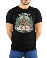 Funny Bigfoot Grabbed My Wiener Campfire Cookout Tshirt - model wearing black tee with hands behind back