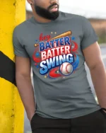 Patriotic Hey Batter Batter Swing Baseball Graphic Tee - model wearing grey tee, leaning on column