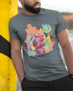 Colorful Pop Art Geometric Monkey Banana Dream Graphic Tee - model wearing grey tee, leaning on column