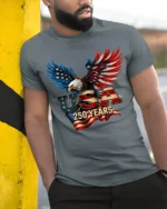 Majestic Bald Eagle USA 250 Years Freedom Bicentennial Tee - model wearing grey tee, leaning on column