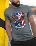 Commemorative 250th Anniversary Eagle Liberty Bell Tshirt - model wearing grey tee, leaning on column