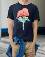 Dreamy Floating Whale Waterfall Island Fox Nature Graphic Tee - model wearing navy tee with hands in pockets