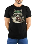 Furious Tax Season Raccoon 1099 Paperwork Funny Graphic Tee - model wearing black tee with hands behind back
