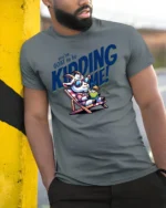 Amusing You have Goat To Be Kidding Me Vacation Graphic Tee - model wearing grey tee, leaning on column