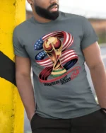 Glory Football Championship Trophy American Flag Graphic Tee - model wearing grey tee, leaning on column