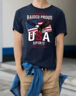 Inspiring Born Free Raised Proud Eagle Patriotic Graphic Tee - model wearing navy tee with hands in pockets