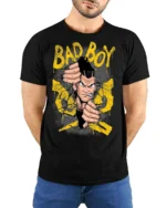 Bad Boy Cracking Wall Anime Mascot Graphic Tee - model wearing black tee with hands behind back