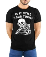 Relatable Is It Still Your Turn Board Game Skeleton Graphic Tee - model wearing black tee with hands behind back
