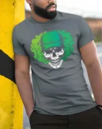 Striking Green Baseball Cap Skull Vapor Smoke Graphic Tee - model wearing grey tee, leaning on column