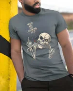 Aggressive Middle Finger Smoking Skeleton Graphic Tee - model wearing grey tee, leaning on column