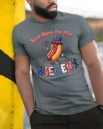 Entertaining Just Here For The Wieners Hot Dog Graphic Tee - model wearing grey tee, leaning on column
