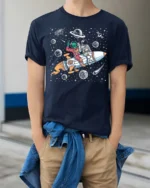 Playful Interstellar Rocket Rider Alien Spaceman Tshirt - model wearing navy tee with hands in pockets