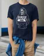 Entertaining Sorry I Missed Warm Ups Skeleton Graphic Tee - model wearing navy tee with hands in pockets