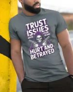 Trust Issues Grim Reaper Gunfighter Graphic Tee - model wearing grey tee, leaning on column