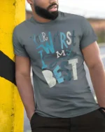 Your Worst Is My Best Slogan Typography Tee - model wearing grey tee, leaning on column