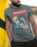 Awesome We Can Do It Empowerment Bones Soft Tshirt - model wearing grey tee, leaning on column