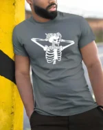 Striking Shocked Skeleton Screaming Crashing Bones Graphic Tee - model wearing grey tee, leaning on column