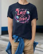 Cosmic Space Adventure Lost In My Own Orbit Graphic Tshirt - model wearing navy tee with hands in pockets