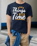 Inspiring Good Things Take Time Positive Graphic Tshirt - model wearing navy tee with hands in pockets