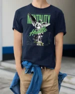 Motivated Angel Statue Mentality Hustle Graphic Tshirt - model wearing navy tee with hands in pockets