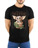 Adorable Gremlins Just Add Water Plant Pot Graphic Tshirt - model wearing black tee with hands behind back