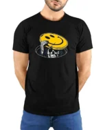 Skeleton Peeking From Manhole Smiley Face Mask Tshirt - model wearing black tee with hands behind back