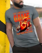 Thrilling Life Is A Game Flaming Dice Graphic Tshirt - model wearing grey tee, leaning on column