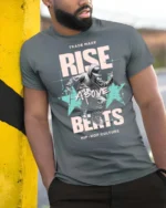 Energetic Breakdancer Rise Above Beats Hip Hop Tshirt - model wearing grey tee, leaning on column