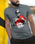 Trendy Greek Zeus Going Viral Sunglasses Graphic Tshirt - model wearing grey tee, leaning on column