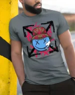 Groovy Stoners Smiley Face Bucket Hat Styli Graphic Tee - model wearing grey tee, leaning on column
