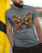 Clockwork Mechanical Butterfly Steampunk Graphic Tshirt - model wearing grey tee, leaning on column