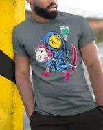 Chilling Reaper Riding Dead Unicorn Funny Weed Graphic Tee - model wearing grey tee, leaning on column