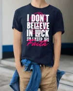 Motivating I Don’t Believe In Luck Keep The Faith Tshirt - model wearing navy tee with hands in pockets