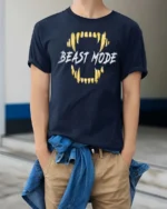 Powerful Beast Mode Golden Teeth Monster Graphic Tshirt - model wearing navy tee with hands in pockets