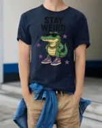 Cool Crocodile Wearing Sneakers Stay Weird Graphic Tee - model wearing navy tee with hands in pockets