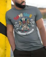 Festive Spirit Skull Native Feather Headdress Tshirt - model wearing grey tee, leaning on column