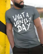 Dystopian Wasteland Flaming Skull Symbol Graphic Tee - model wearing grey tee, leaning on column