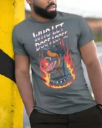 Fierce Who Let Dogs Loose Doberman Flame Graphic Tee - model wearing grey tee, leaning on column