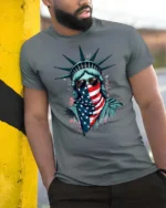 Radical Statue Of Liberty American Flag Bandana Tshirt - model wearing grey tee, leaning on column